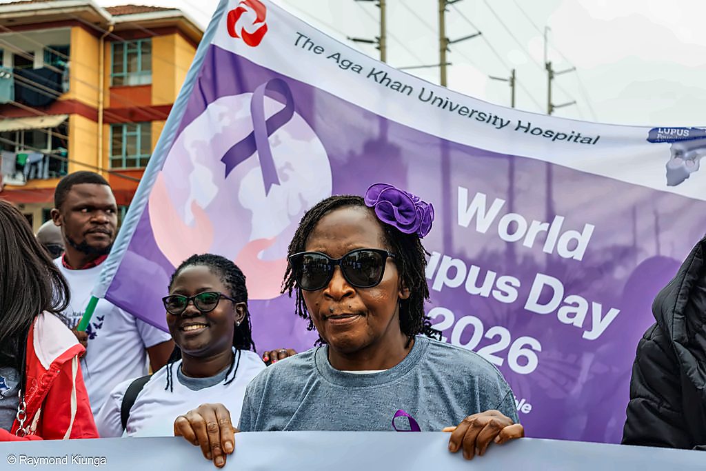 A supporter waving the World Lupus Day flag