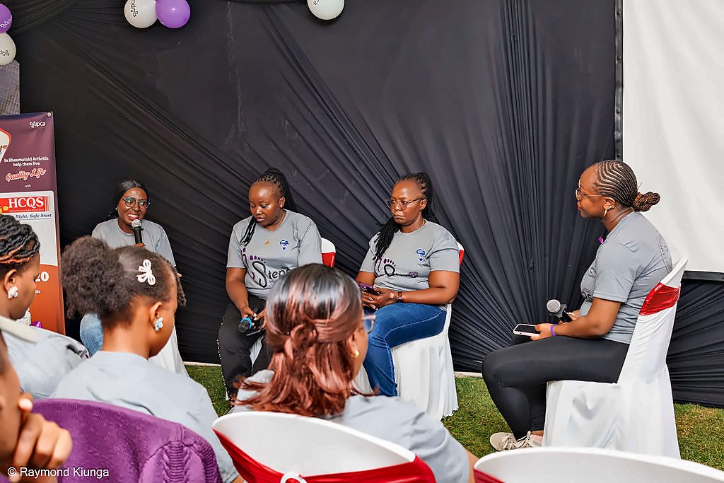 Four people in conversation on stage during the wellness and education programme