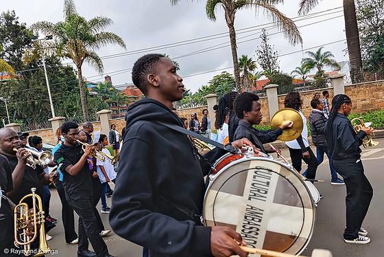 A brass band with drums and cymbals leading the World Lupus Day walk through Nairobi