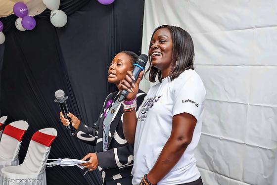 Two speakers sharing a light moment on stage at World Lupus Day 2026