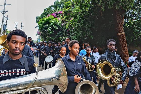 Musicians playing as the walk moves through the city